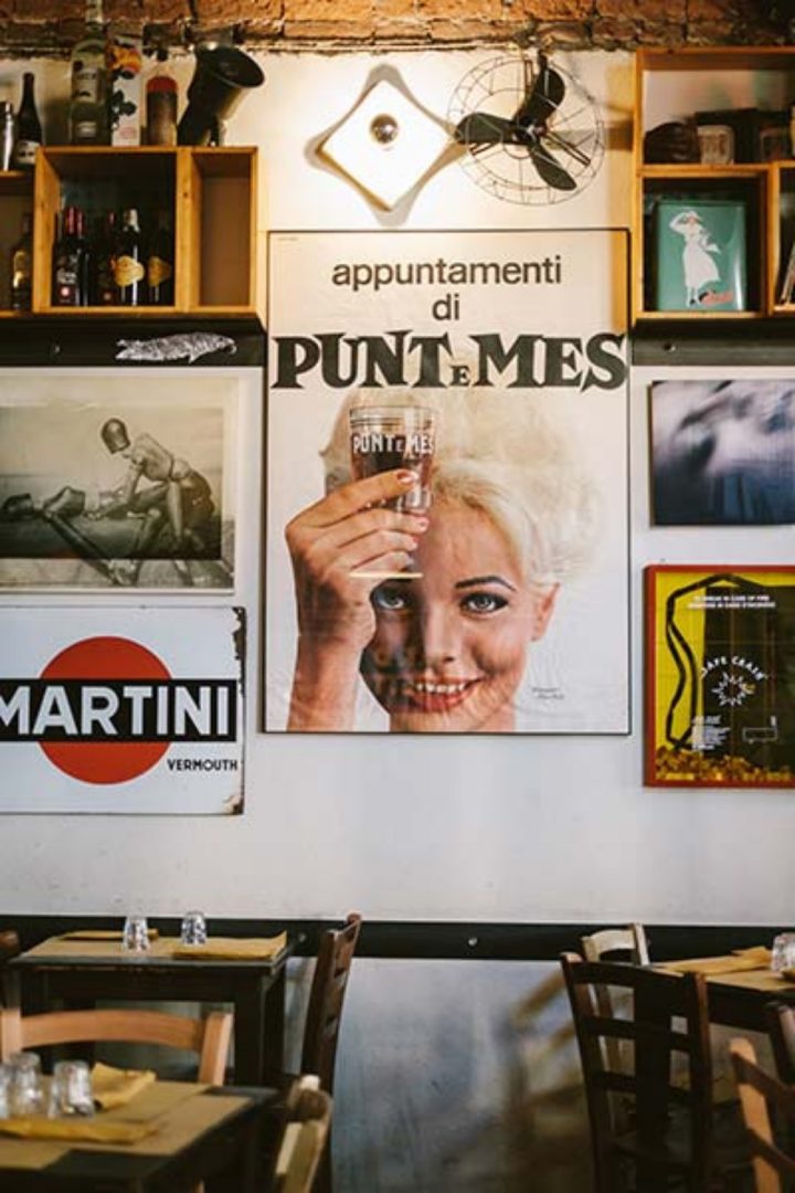 vintage posters and period objects inside piola da cianci in turin