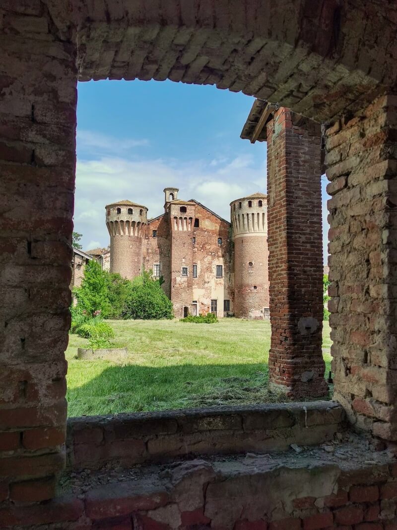The medieval castle of Valeggio as seen from an ancient, red-bricked window